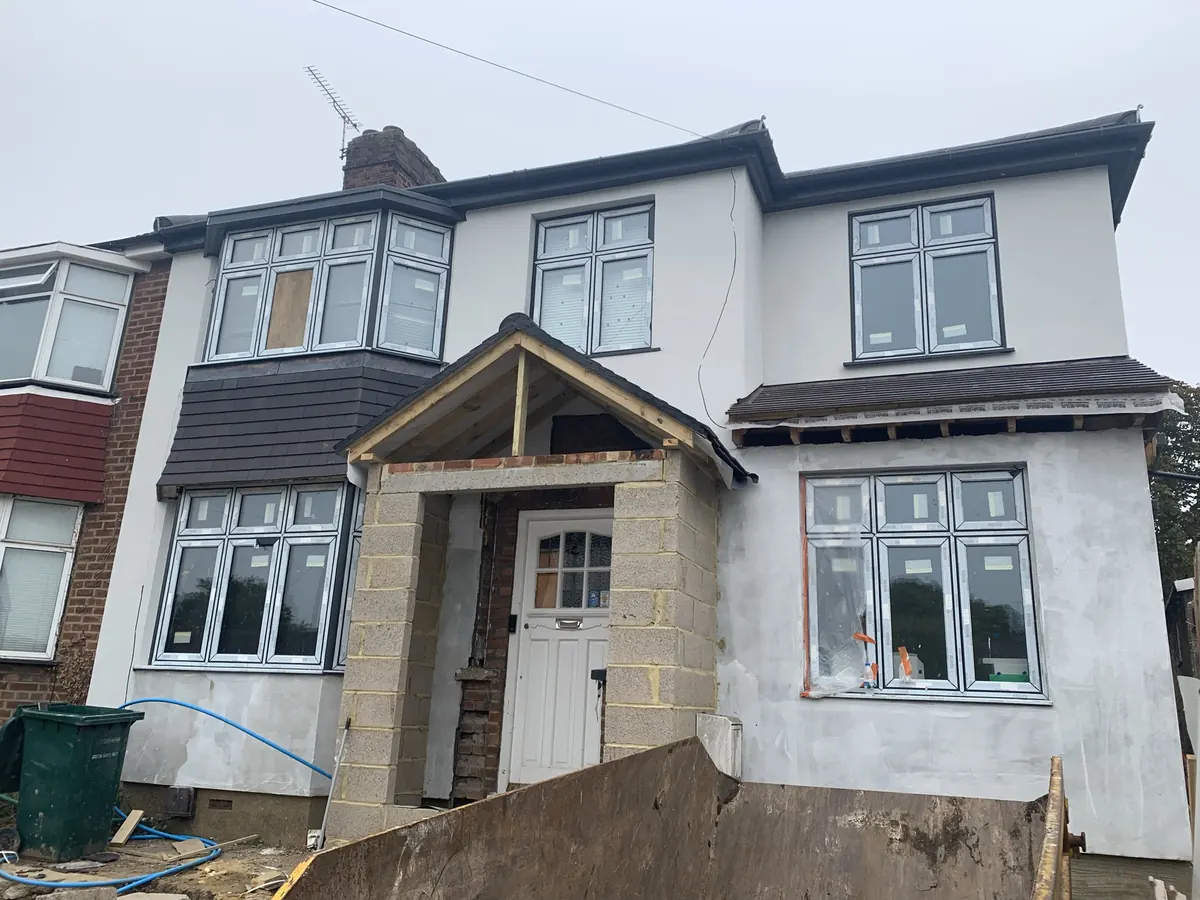 Barnet semi-detached house mid-job with the reinforced base coat applied before the coloured silicone finish