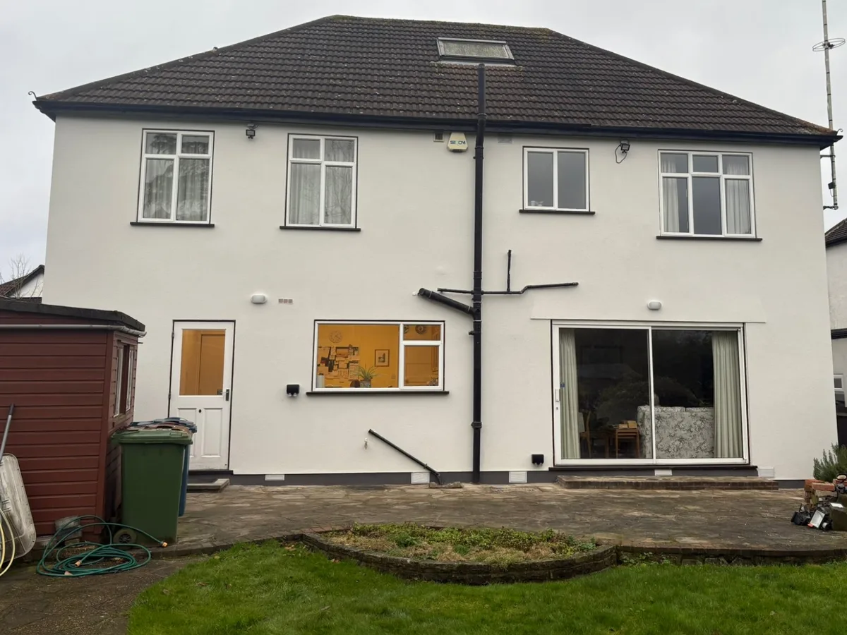 The same rear elevation after re-rendering in a smooth white finish