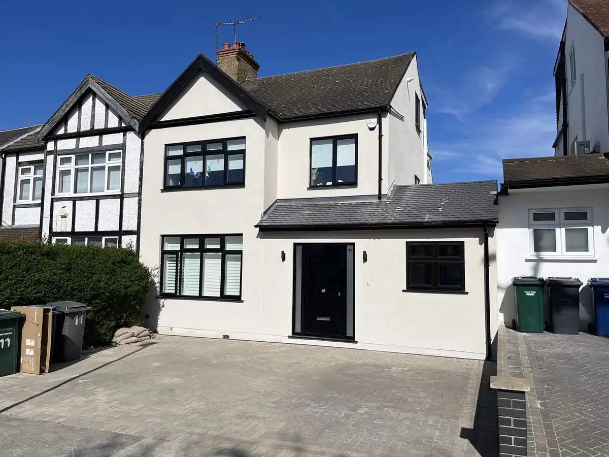 Completed cream render finish on a 1930s semi-detached London home